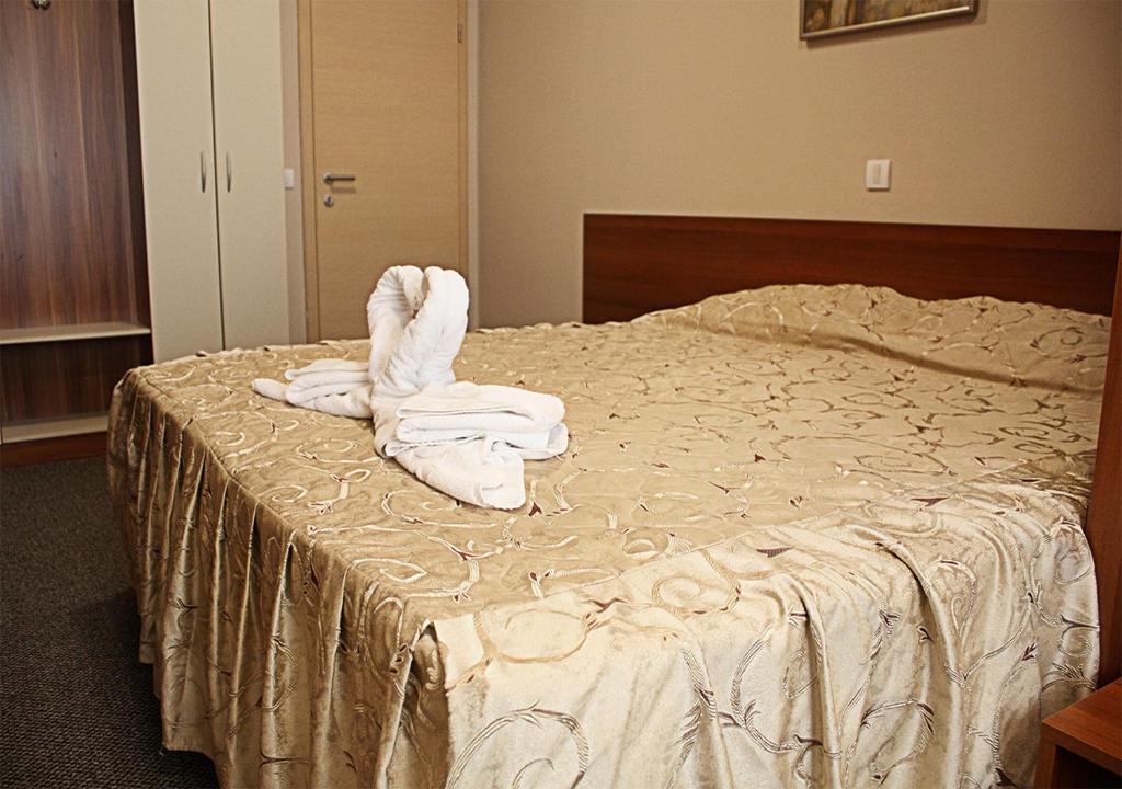 Postel nebo postele na pokoji v ubytování Hotel Ambasador