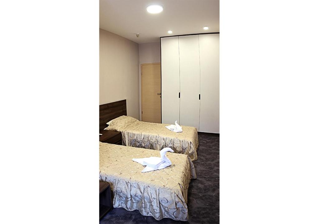 Postel nebo postele na pokoji v ubytování Hotel Ambasador