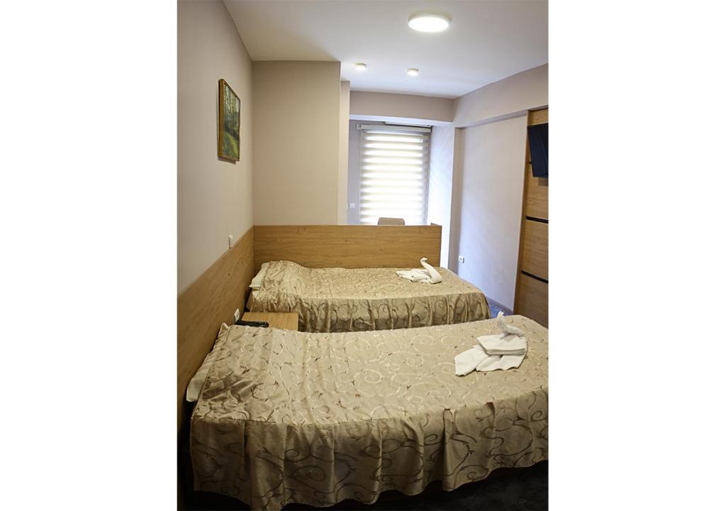 Postel nebo postele na pokoji v ubytování Hotel Ambasador