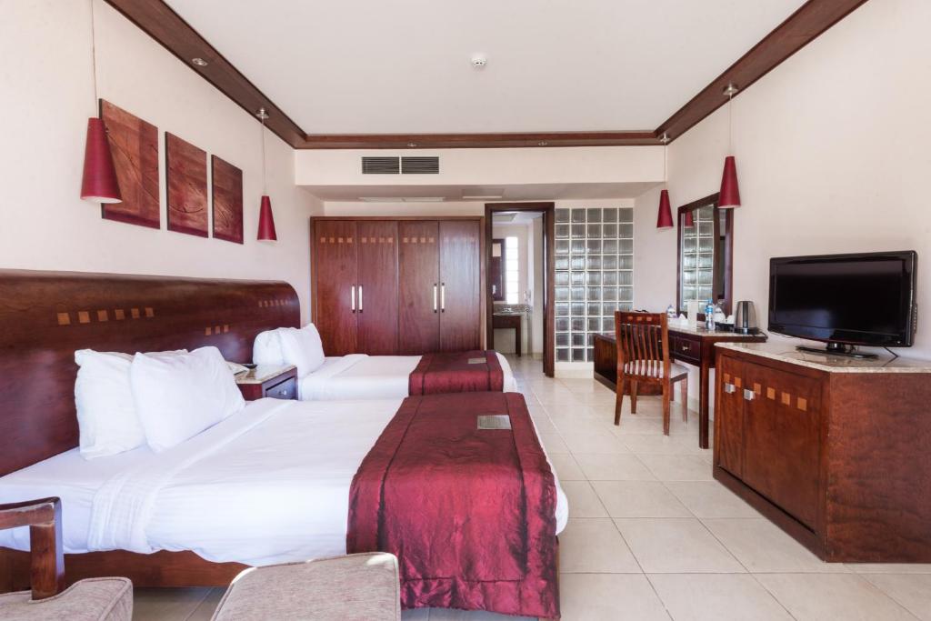 A television and/or entertainment centre at Shams Prestige Abu Soma (Adults Only)