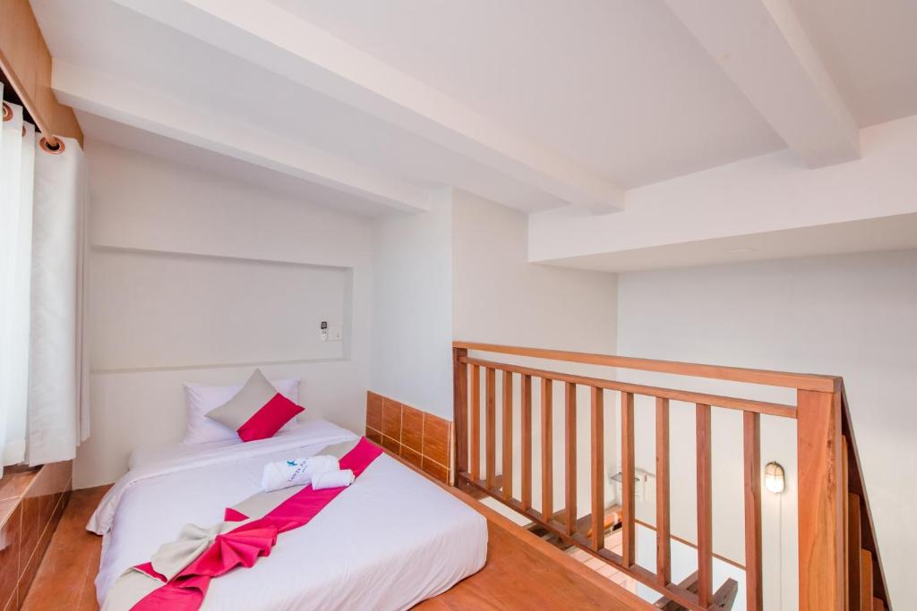 Postel nebo postele na pokoji v ubytování Lanta Ray Bay Hotel