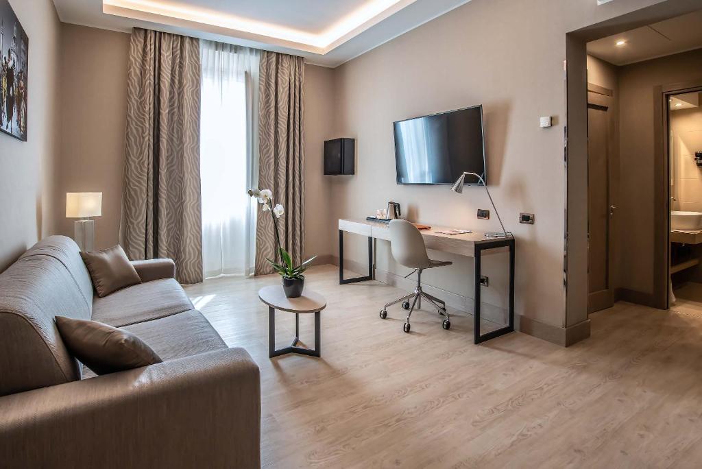 TV a/nebo společenská místnost v ubytování Hotel Genova