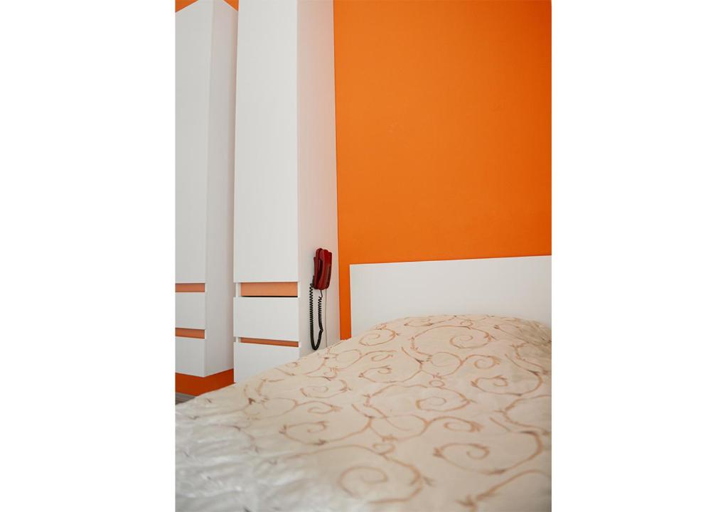 Postel nebo postele na pokoji v ubytování Hotel Ambasador