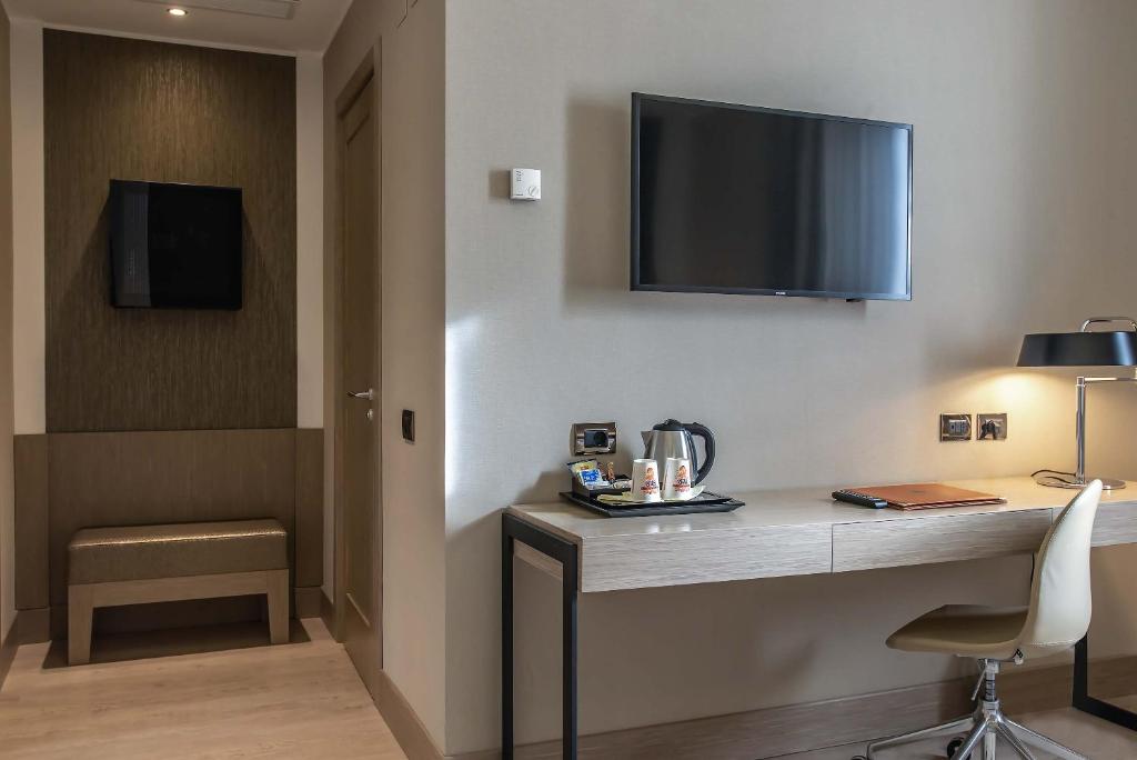 TV a/nebo společenská místnost v ubytování Hotel Genova