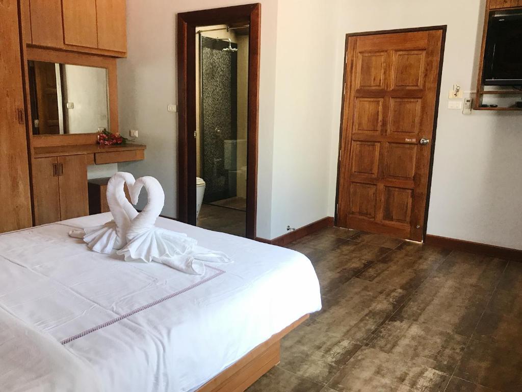 Postel nebo postele na pokoji v ubytování The Nest Samui