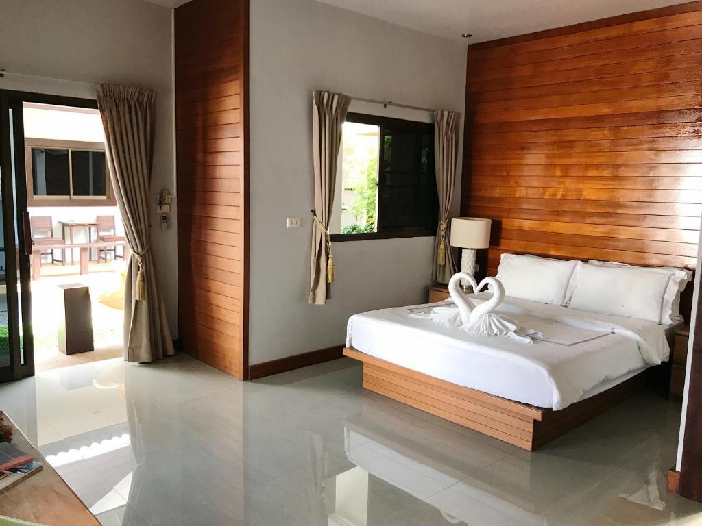 Postel nebo postele na pokoji v ubytování The Nest Samui