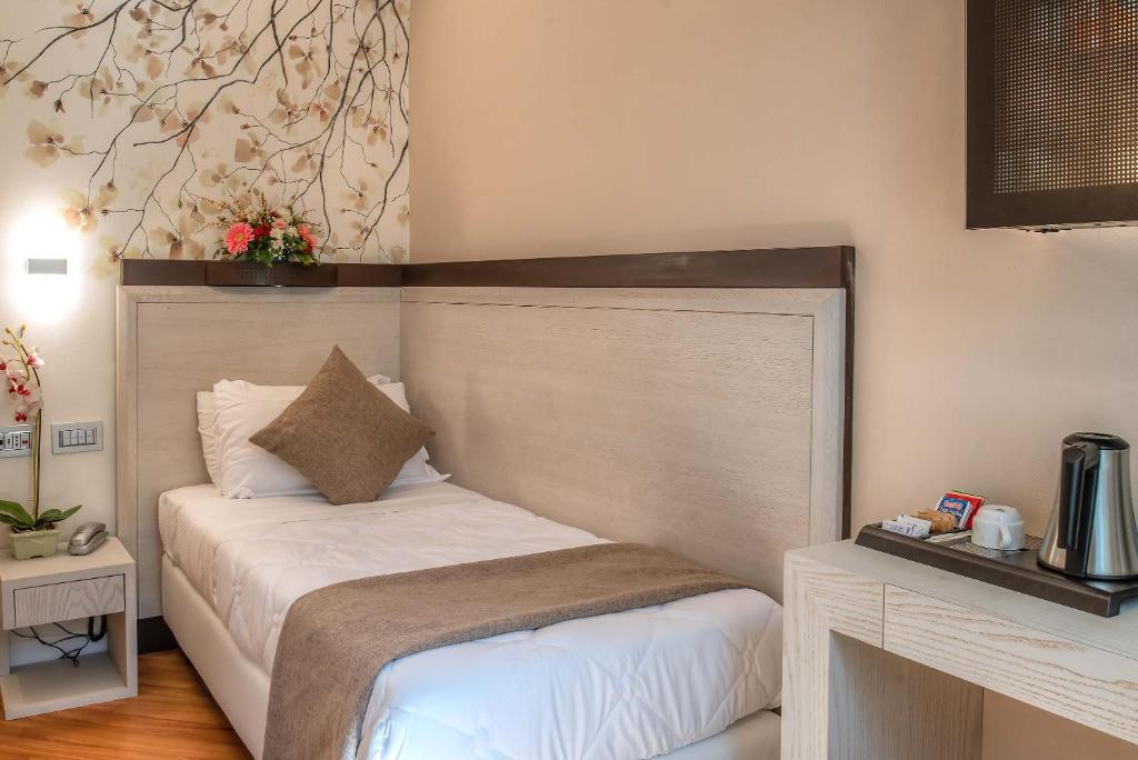 Postel nebo postele na pokoji v ubytování Hotel Memphis