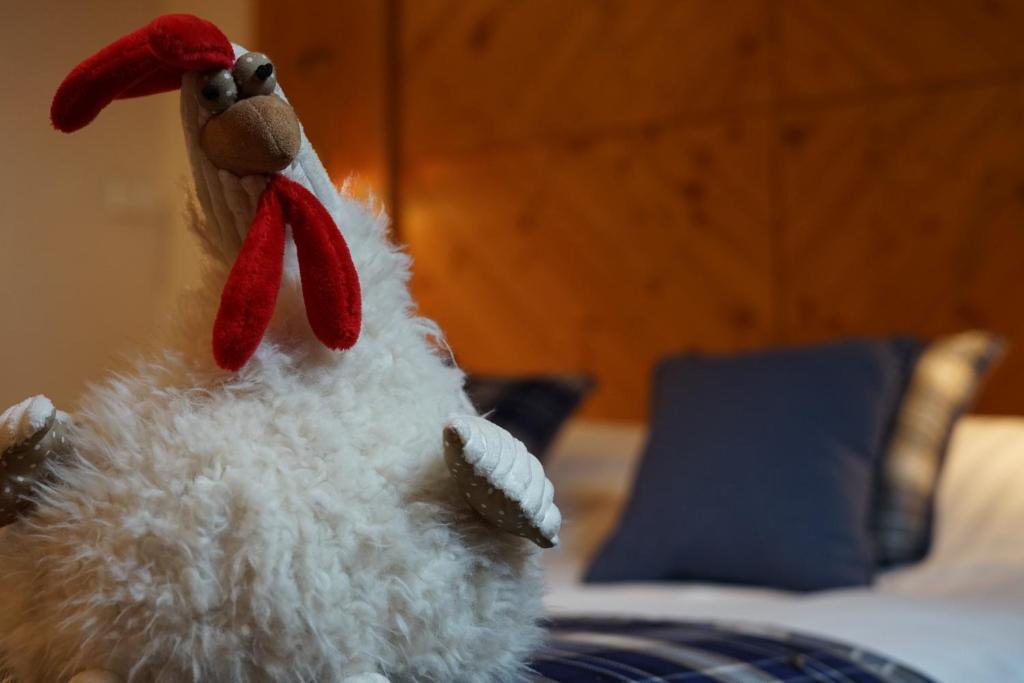 Postel nebo postele na pokoji v ubytování Hôtel Le Riquewihr