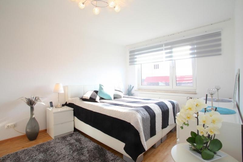 Cama o camas de una habitación en Clean&Comfort Apartments Near Hannover Fairgrounds