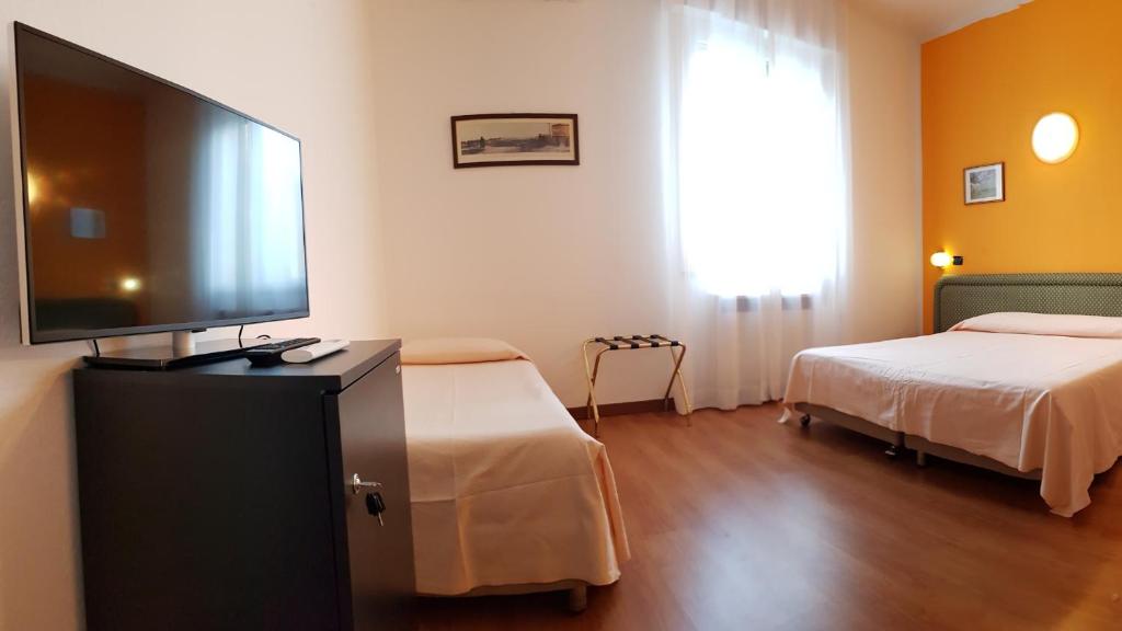 Posteľ alebo postele v izbe v ubytovaní Hotel Terme di Castel San Pietro