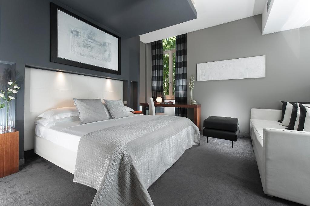 Postel nebo postele na pokoji v ubytování Metropolis - Hotel di Charme