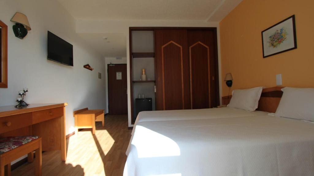 Postel nebo postele na pokoji v ubytování Hotel Luar