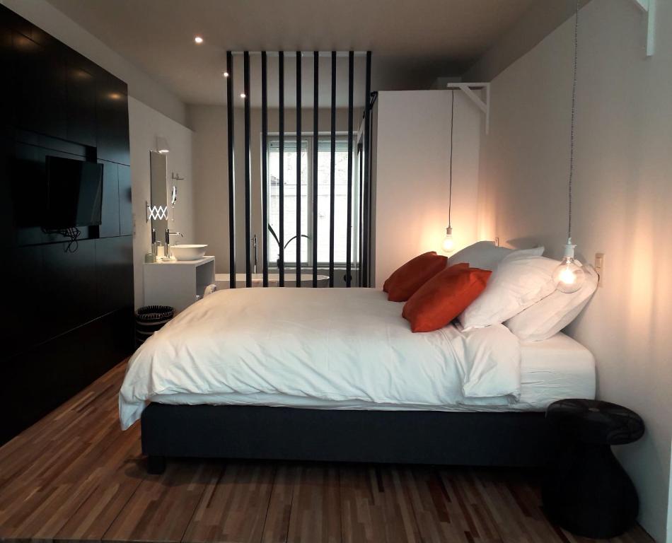 Ένα ή περισσότερα κρεβάτια σε δωμάτιο στο B&B Ar'Home