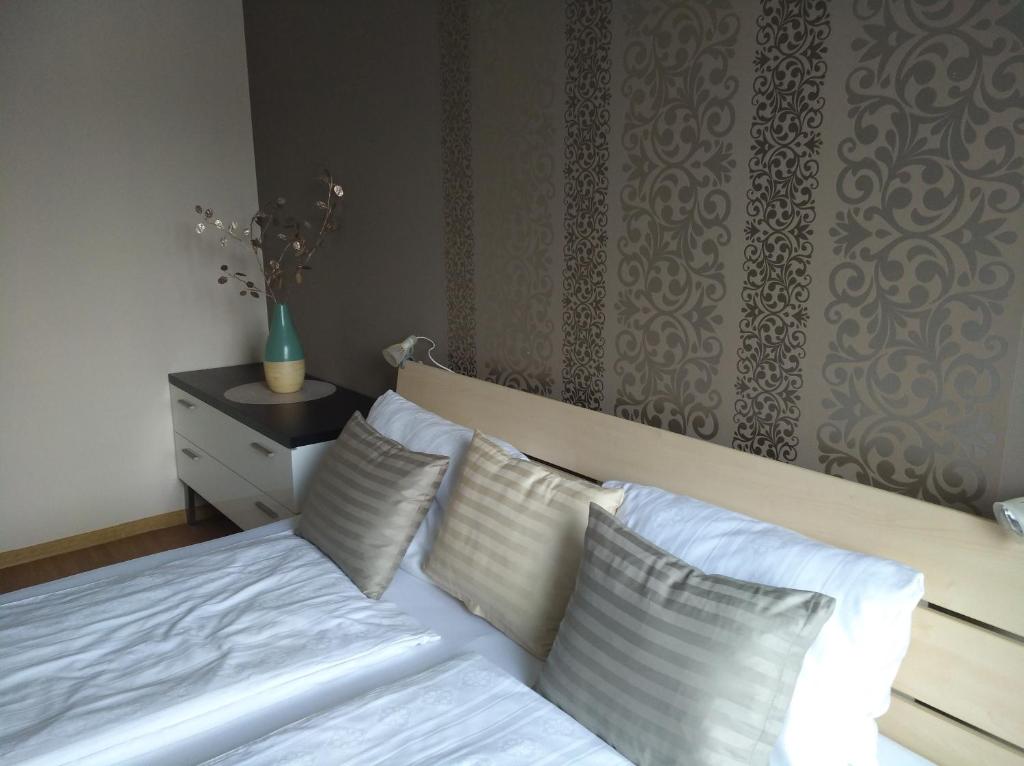 Postel nebo postele na pokoji v ubytování Aqua Apartmanok
