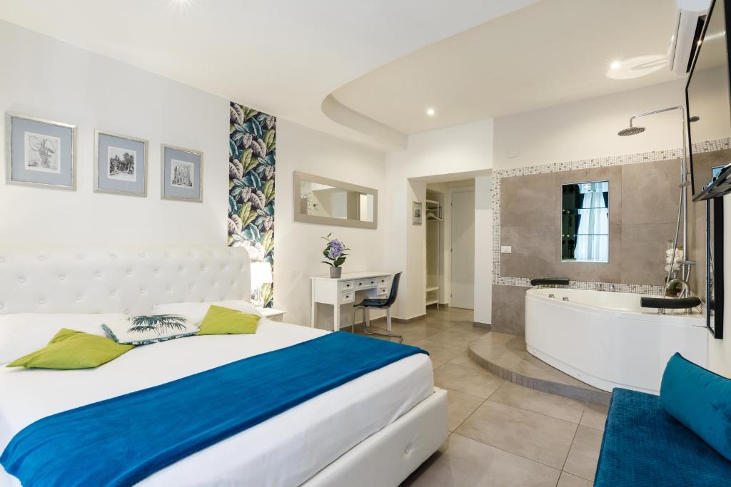 Postel nebo postele na pokoji v ubytování Aeterna Rooms Collection GuestHouse