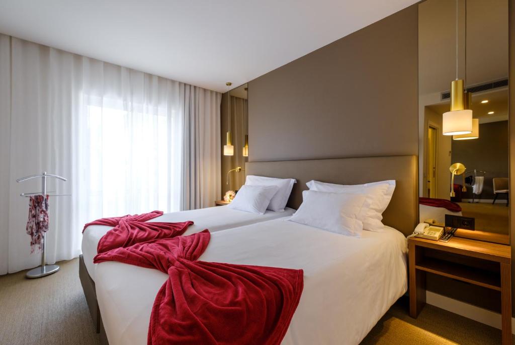 Кровать или кровати в номере Hotel Regina