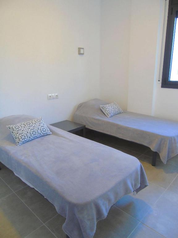 Postel nebo postele na pokoji v ubytování Appartement proche mer avec piscine Rosas