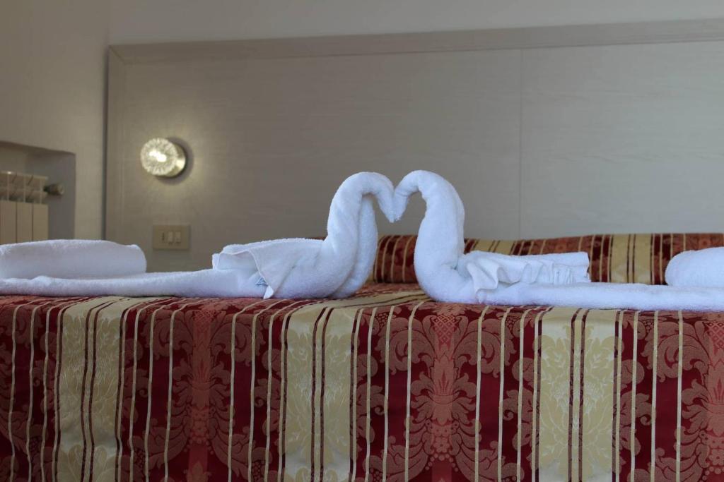 Postel nebo postele na pokoji v ubytování Hotel Al Bosco