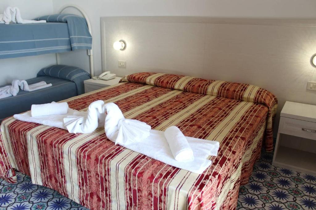 Postel nebo postele na pokoji v ubytování Hotel Al Bosco