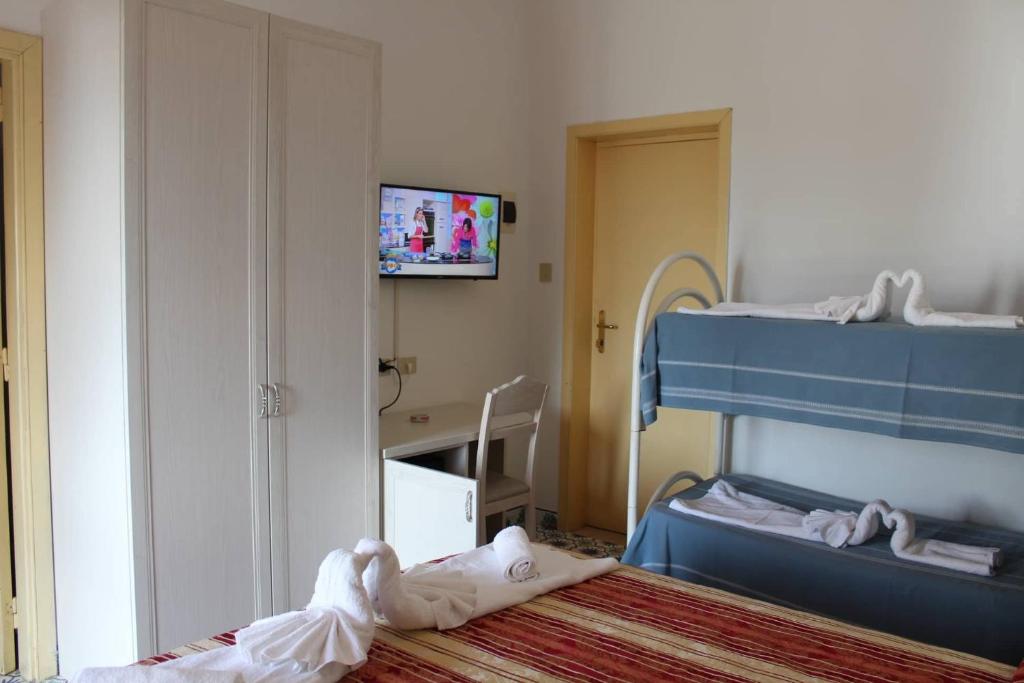 Postel nebo postele na pokoji v ubytování Hotel Al Bosco