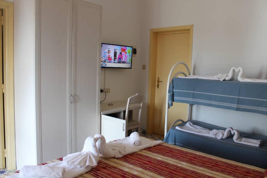 Postel nebo postele na pokoji v ubytování Hotel Al Bosco