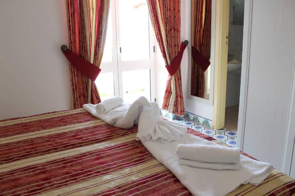 Postel nebo postele na pokoji v ubytování Hotel Al Bosco