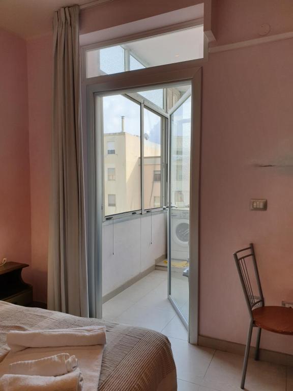 Postel nebo postele na pokoji v ubytování Elisart Guest House