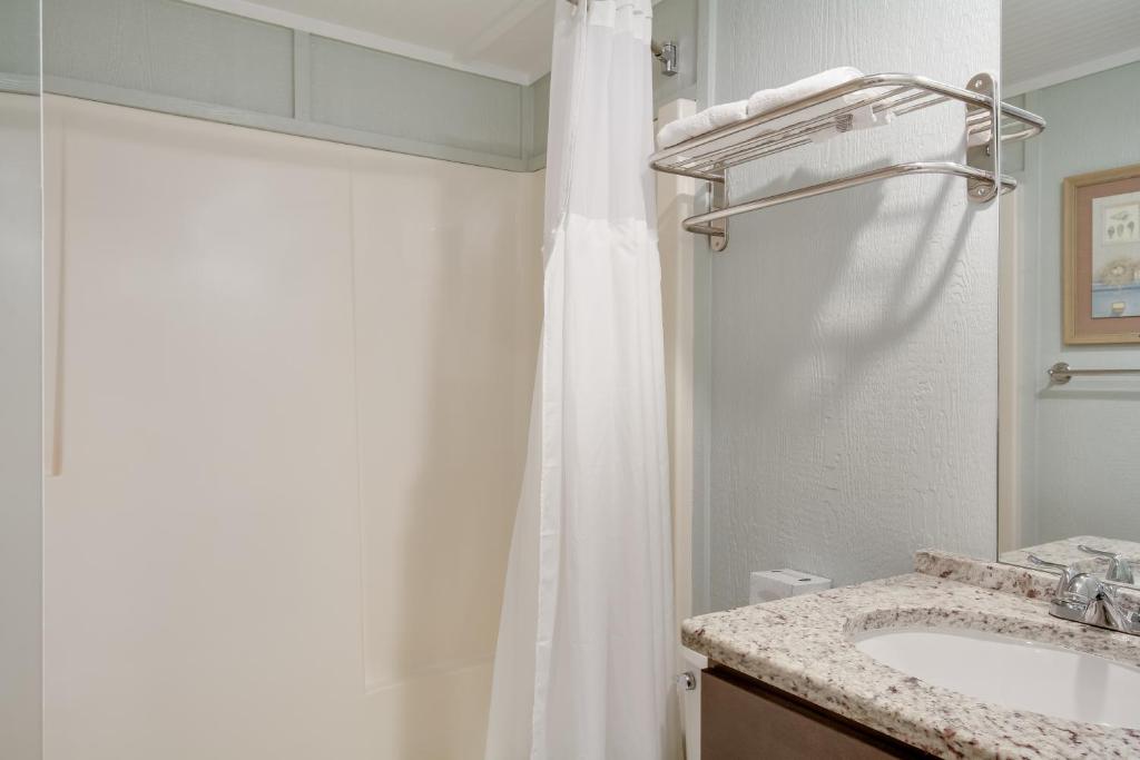 Postel nebo postele na pokoji v ubytování Tar Heel Motel