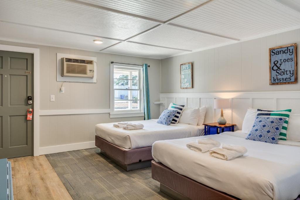 Postel nebo postele na pokoji v ubytování Tar Heel Motel