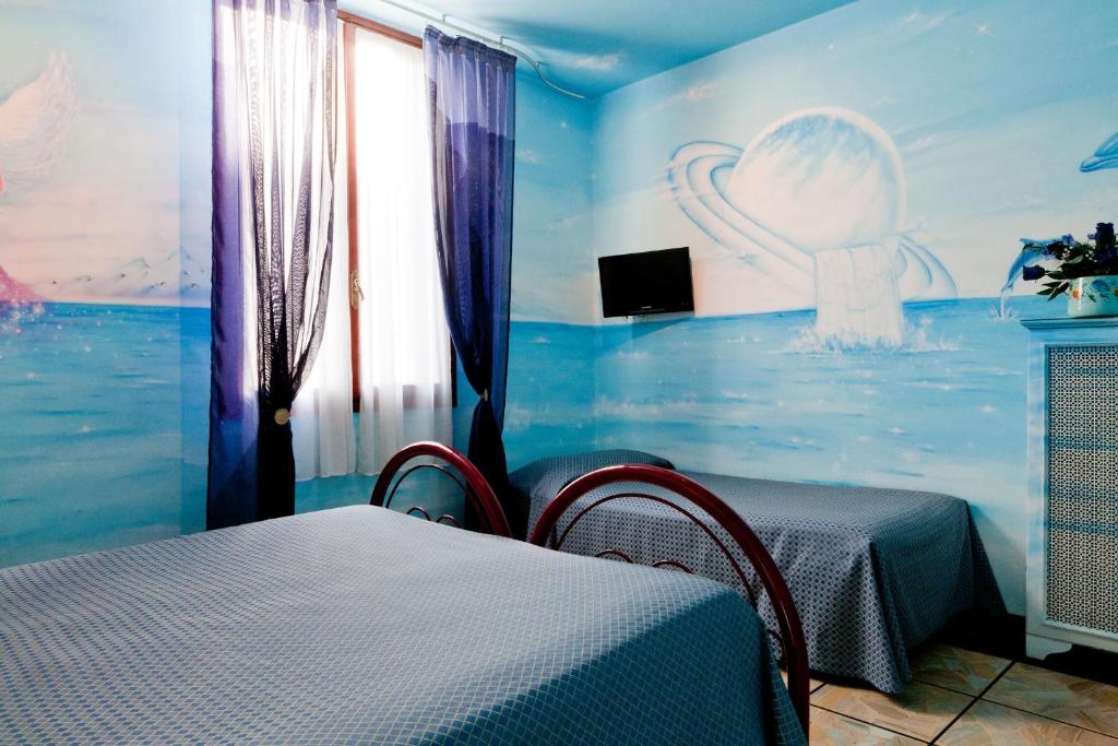 Postel nebo postele na pokoji v ubytování Hotel Masaccio