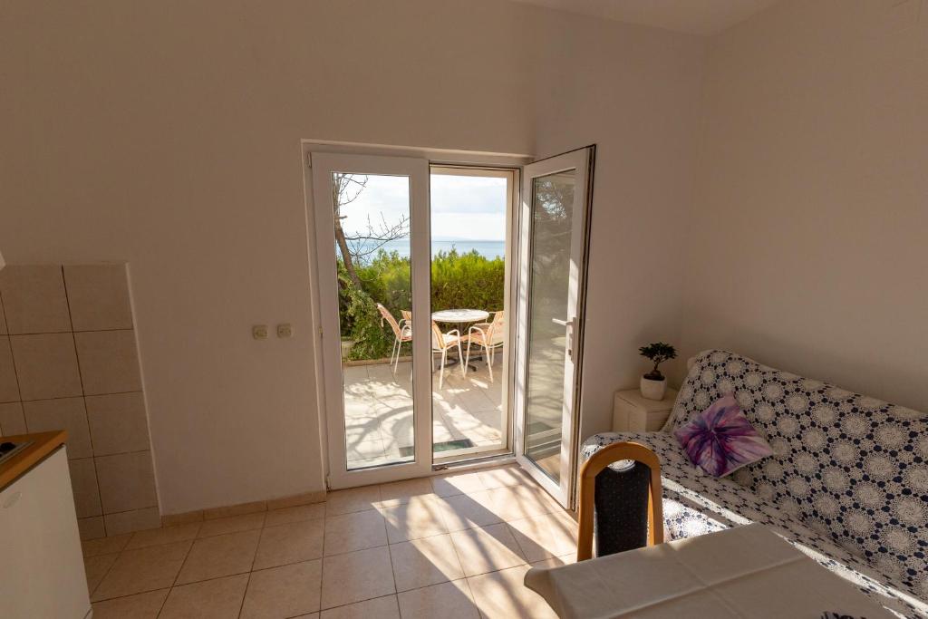 Postel nebo postele na pokoji v ubytování Apartmani Maja