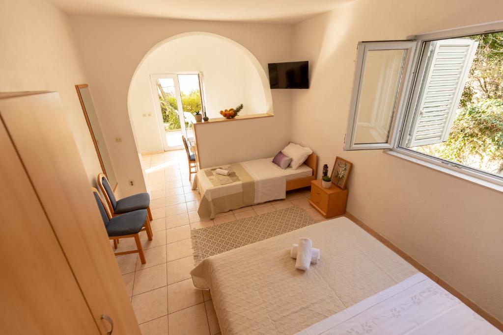 Postel nebo postele na pokoji v ubytování Apartmani Maja