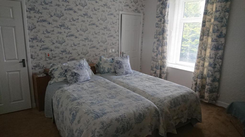 Postel nebo postele na pokoji v ubytování Nethermains House