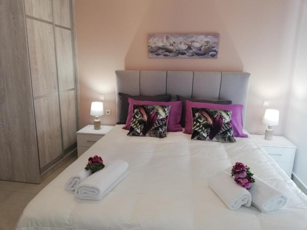 Postel nebo postele na pokoji v ubytování Meltemi Beach Apartments