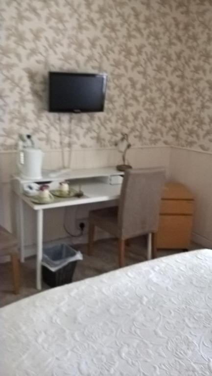 TV a/nebo společenská místnost v ubytování Nethermains House