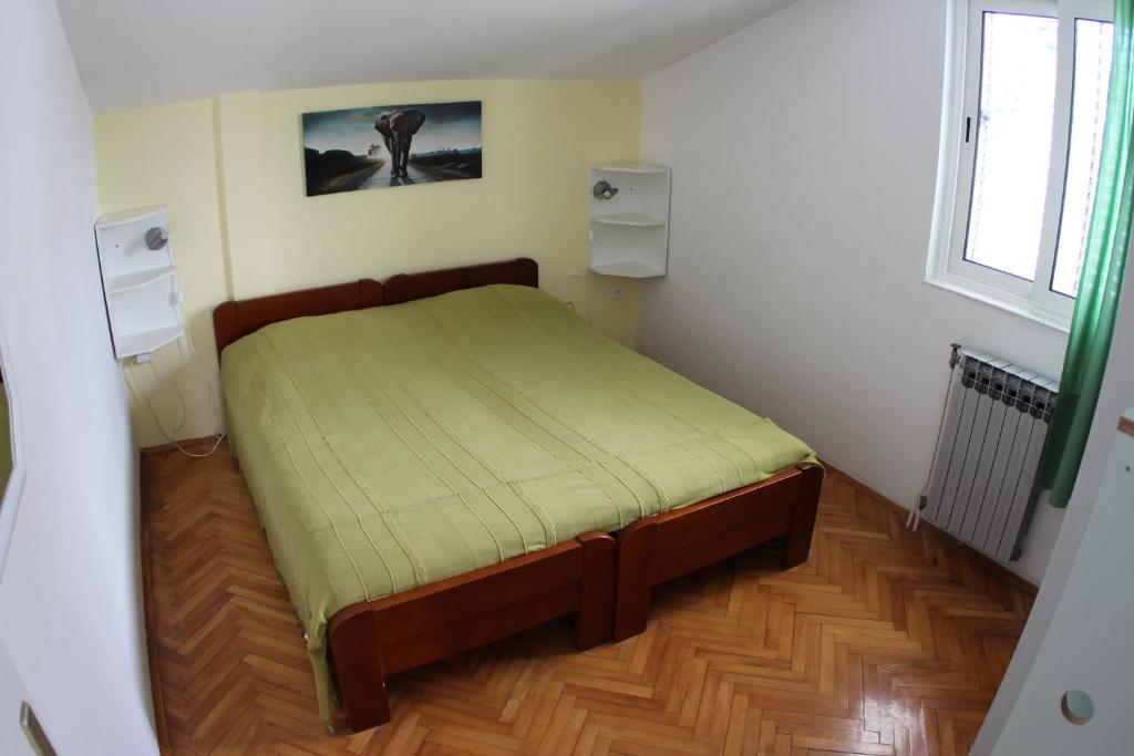 Postel nebo postele na pokoji v ubytování Apartmani Šurlin