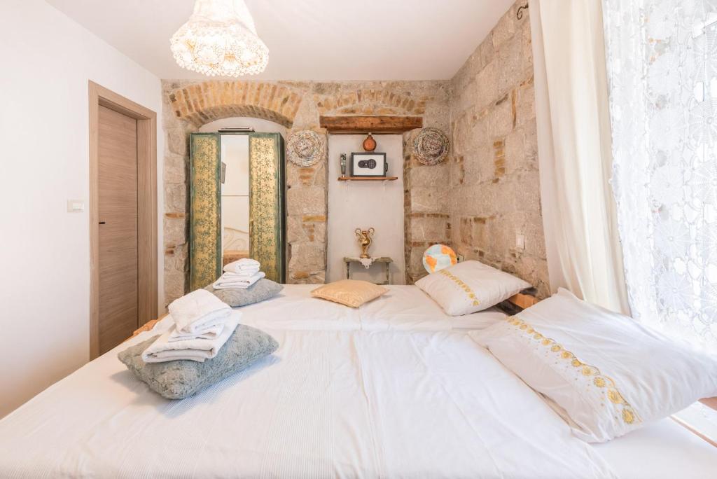 Postel nebo postele na pokoji v ubytování Kovacic Rooms