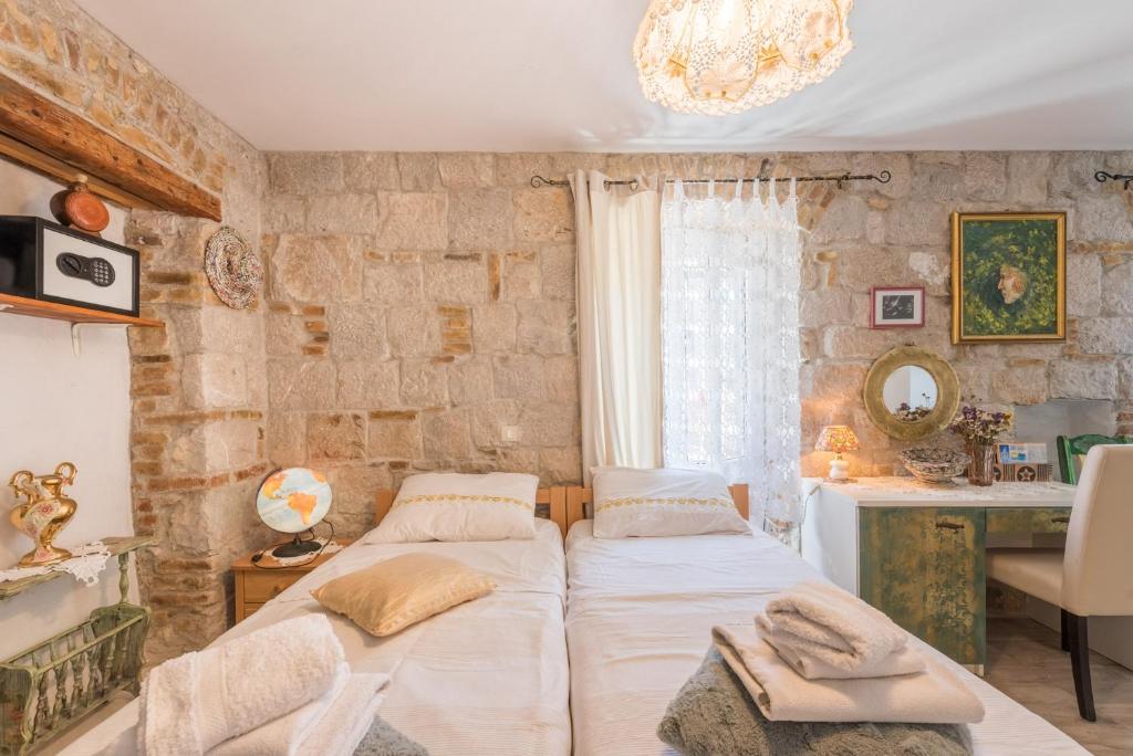 Postel nebo postele na pokoji v ubytování Kovacic Rooms