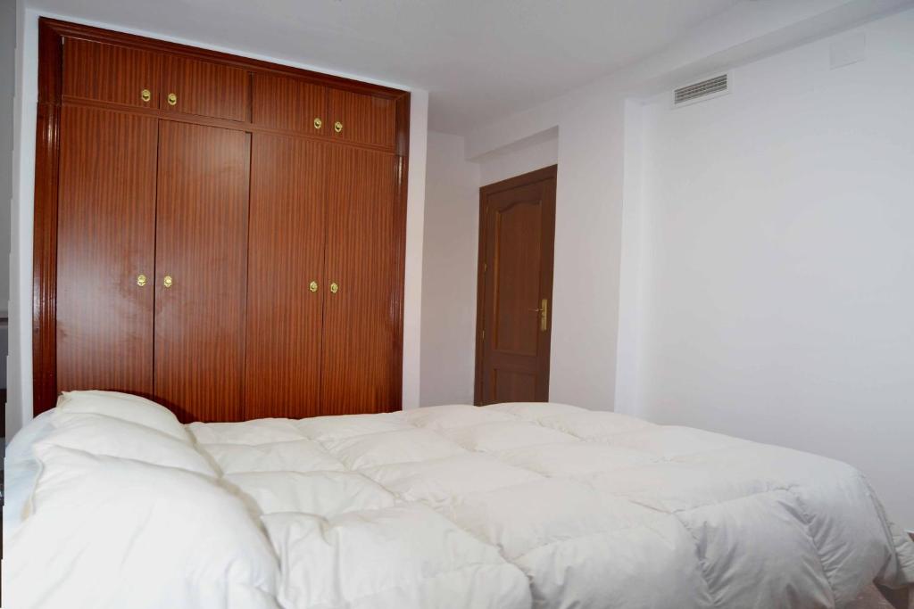 Posteľ alebo postele v izbe v ubytovaní Apartamento Corregidor