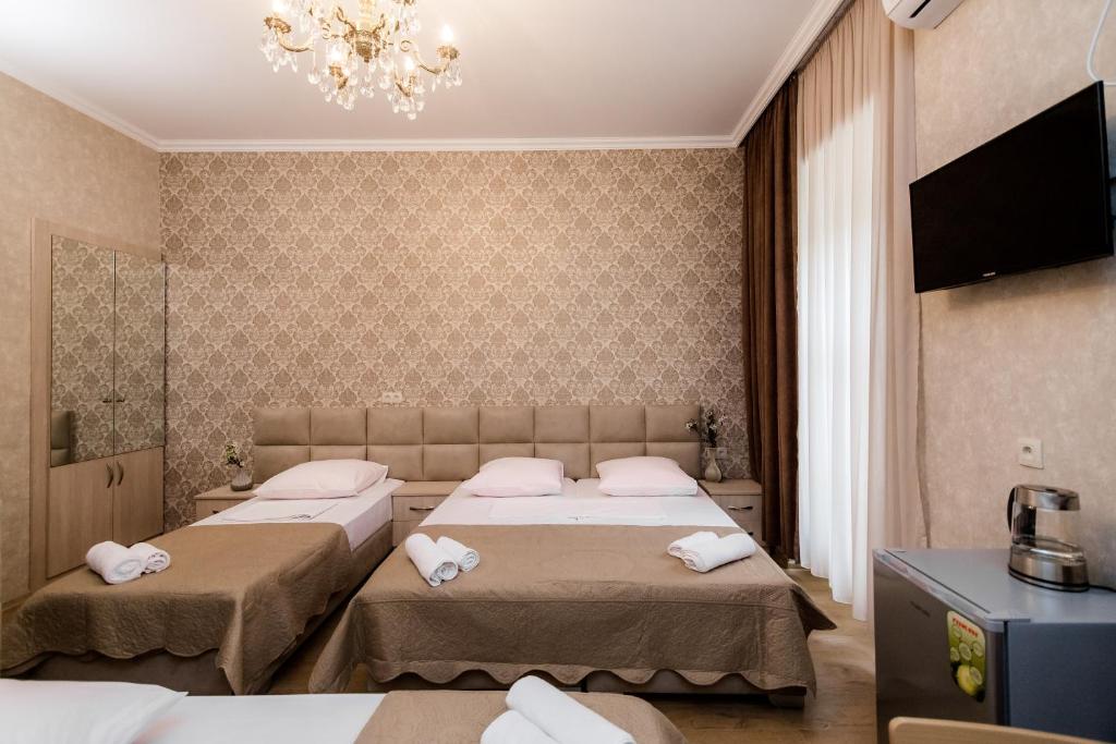 Postel nebo postele na pokoji v ubytování Star Hotel
