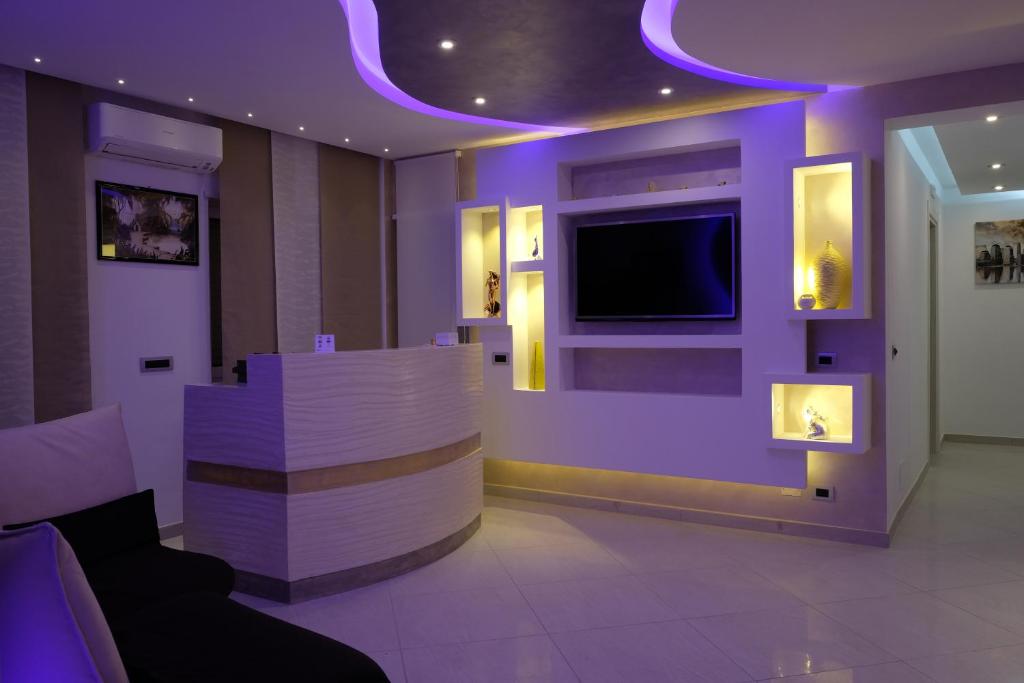 TV a/nebo společenská místnost v ubytování B&B Rossini Luxury