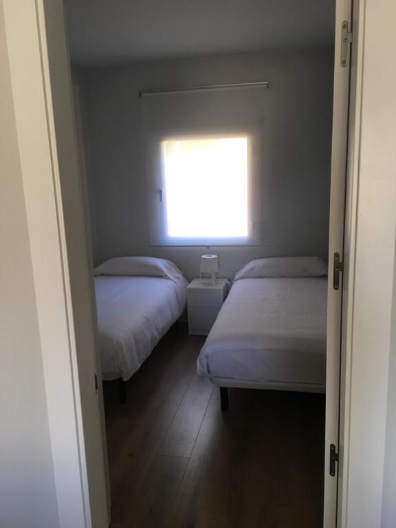 Postel nebo postele na pokoji v ubytování Apartaments La Pertusa 1r piso