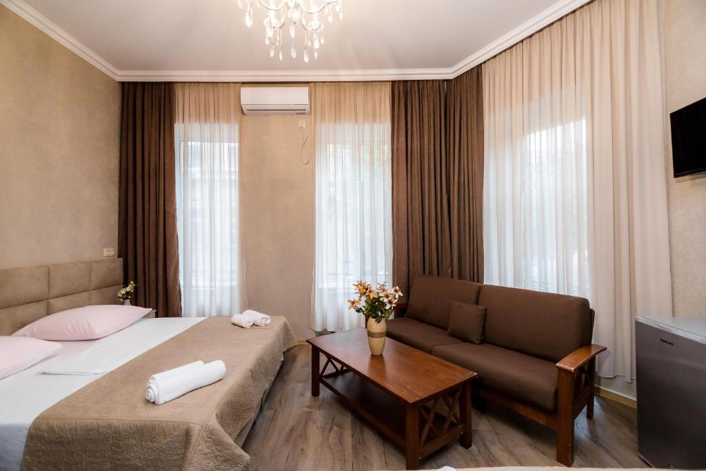 Postel nebo postele na pokoji v ubytování Star Hotel