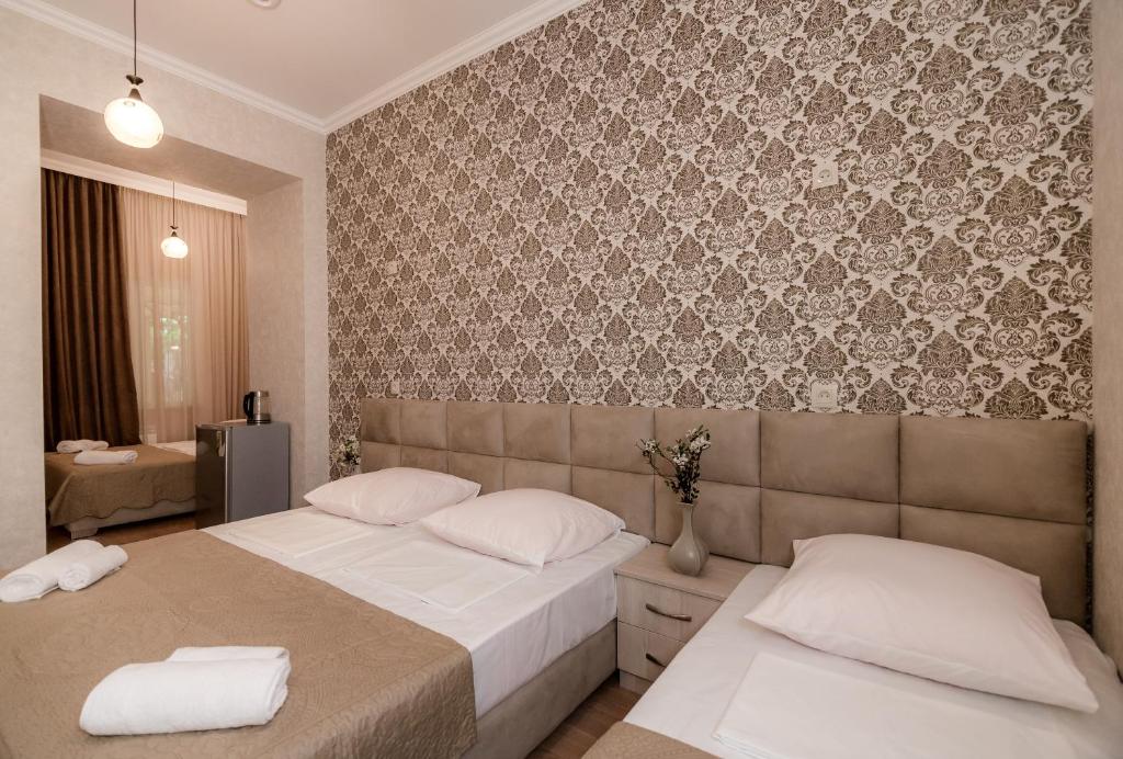 Postel nebo postele na pokoji v ubytování Star Hotel