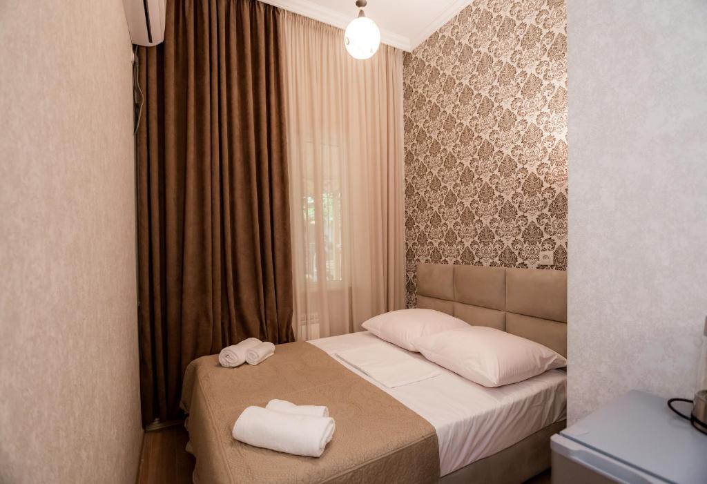 Postel nebo postele na pokoji v ubytování Star Hotel