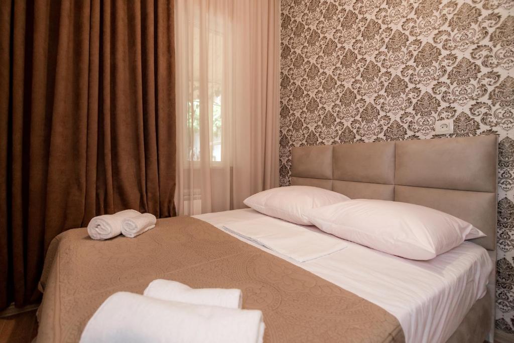 Postel nebo postele na pokoji v ubytování Star Hotel
