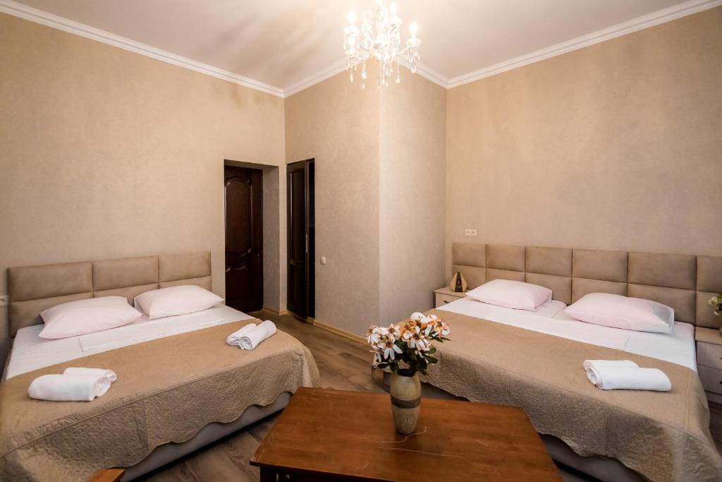 Postel nebo postele na pokoji v ubytování Star Hotel