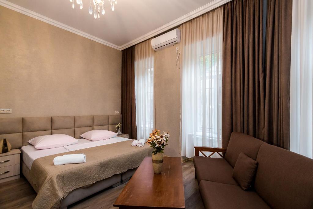 Postel nebo postele na pokoji v ubytování Star Hotel