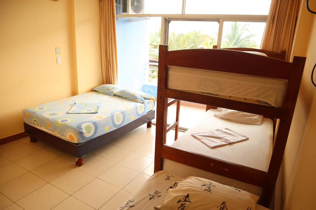 Postel nebo postele na pokoji v ubytování Hotel Atacames Inn