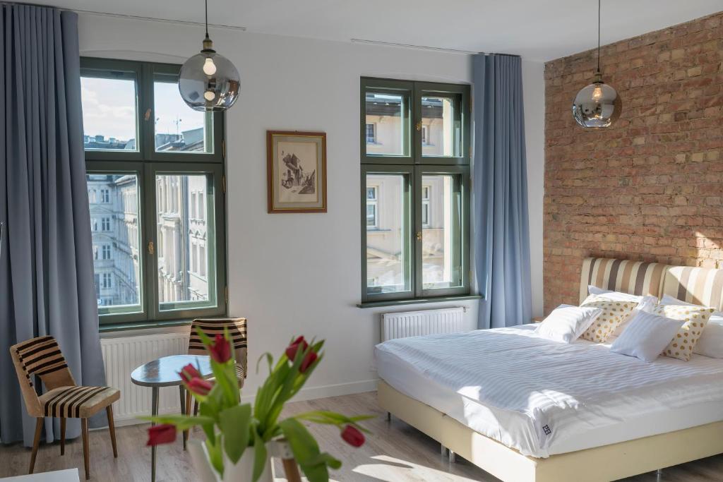 Posteľ alebo postele v izbe v ubytovaní PROVENIR HOME STRZELECKA 25